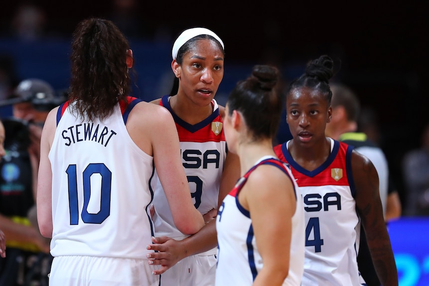 A'Ja Wilson of the United States is surrounded by teammates.