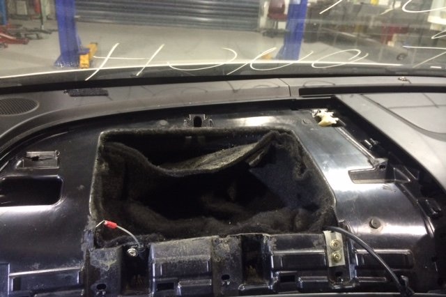 A hidden compartment in a car dashboard