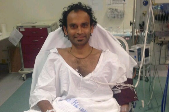 Bishan Rajapakse being treated in hospital after being knocked out by a whale at Bondi