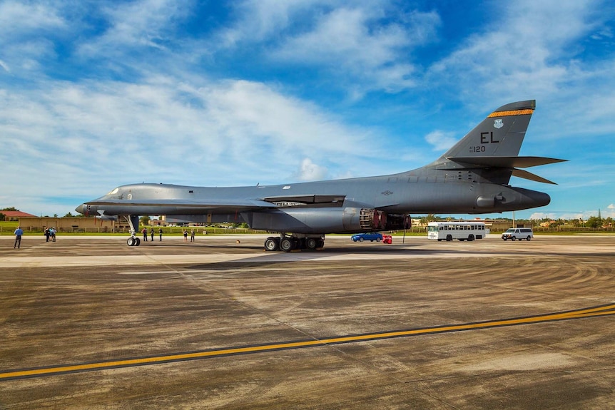 A side view of a B1 bomber at an air base on Guam.