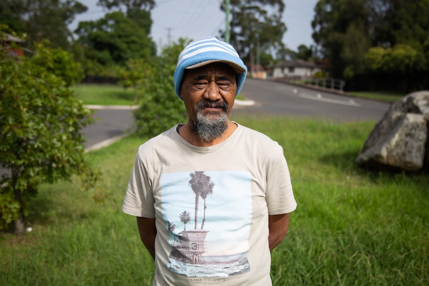 a man wearing a hat looking