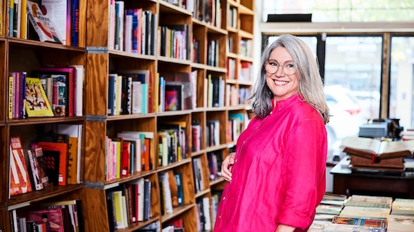 Woman smiling in bookstore