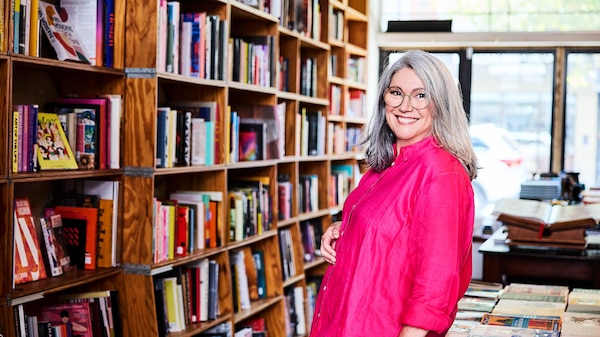 Woman smiling in bookstore