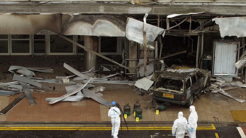Doctors questioned: Forensic officers examine the scene of the Glasgow attack