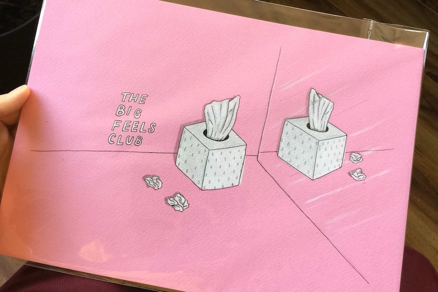 A photo of a pink envelope with artwork for the Big Feels Club.