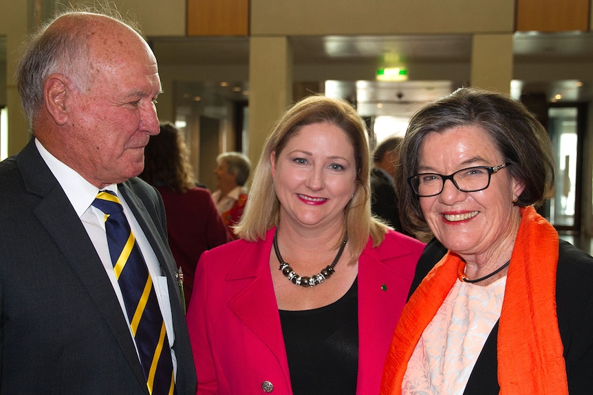 Tony Windsor stands sideways looking at Rebekah Sharkie and Cathy McGowan.