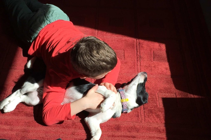 Lucien and Reggie, the family dog, taken by Lucien's mother Cathy Pryor.