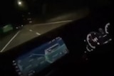 Inside a car at night.