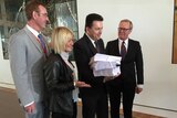 Nick Xenophon receives the petition