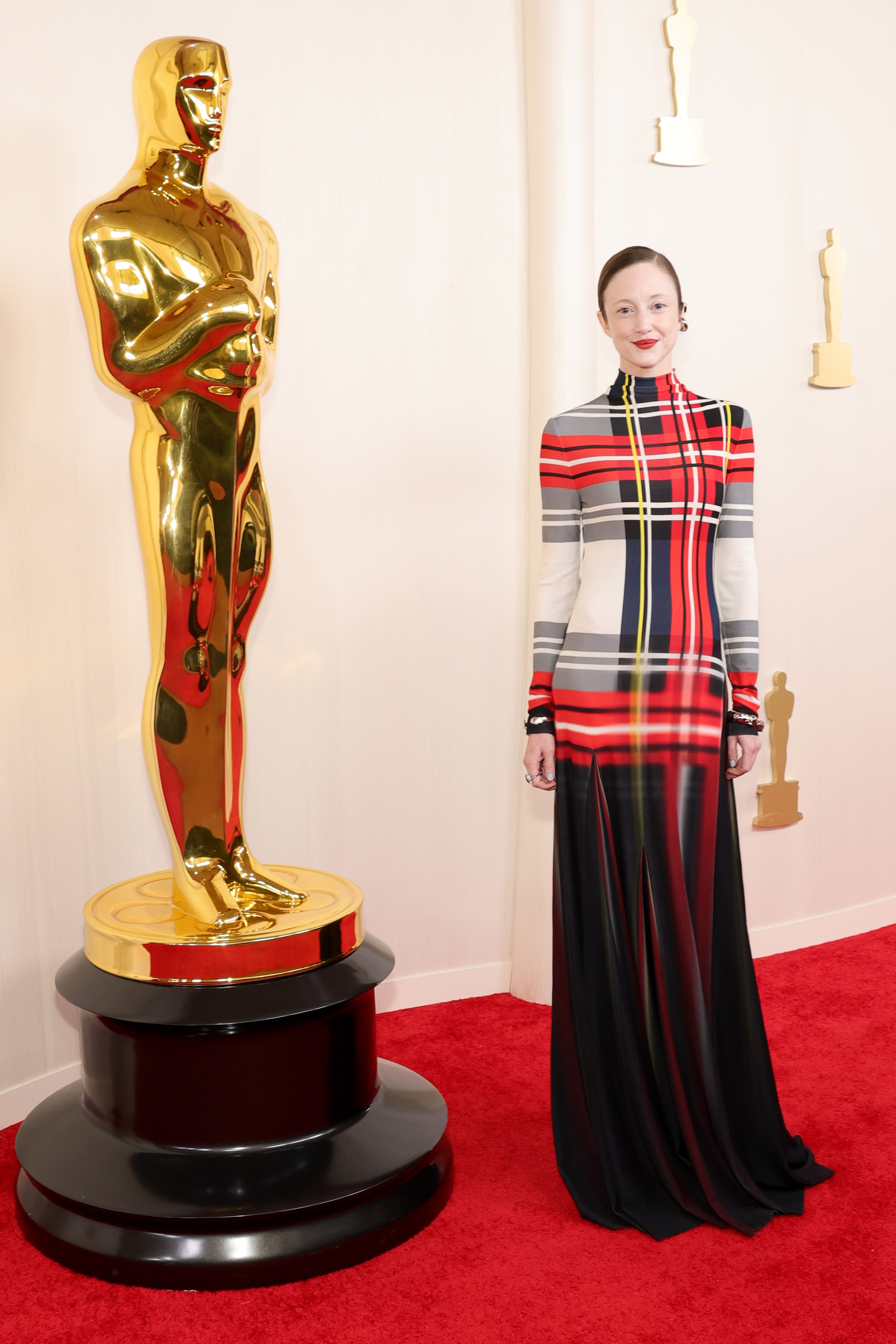 Andrea Riseborough poses on the Oscars red carpet