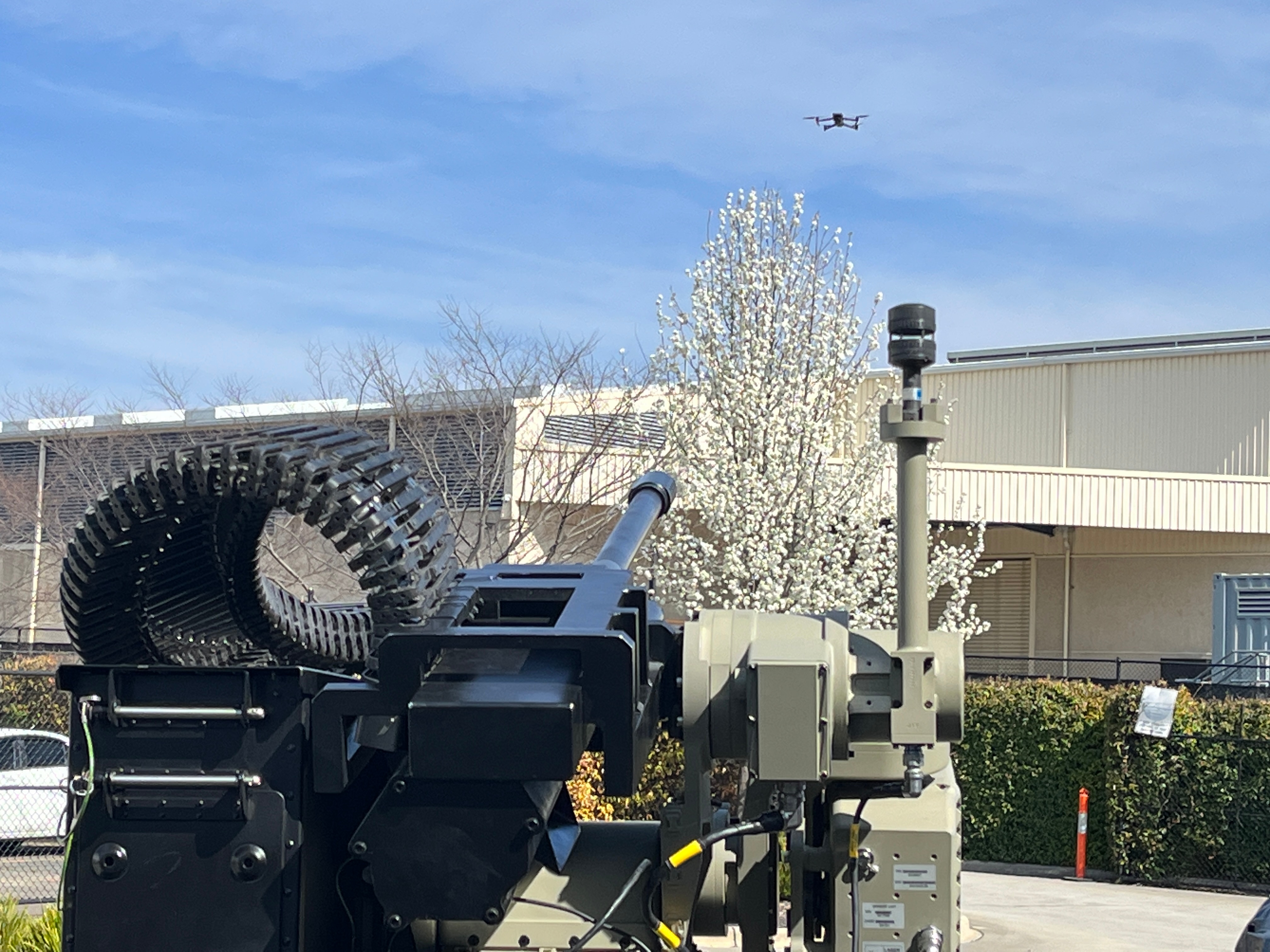 Slinger counter drone system aiming at a drone in the air. 