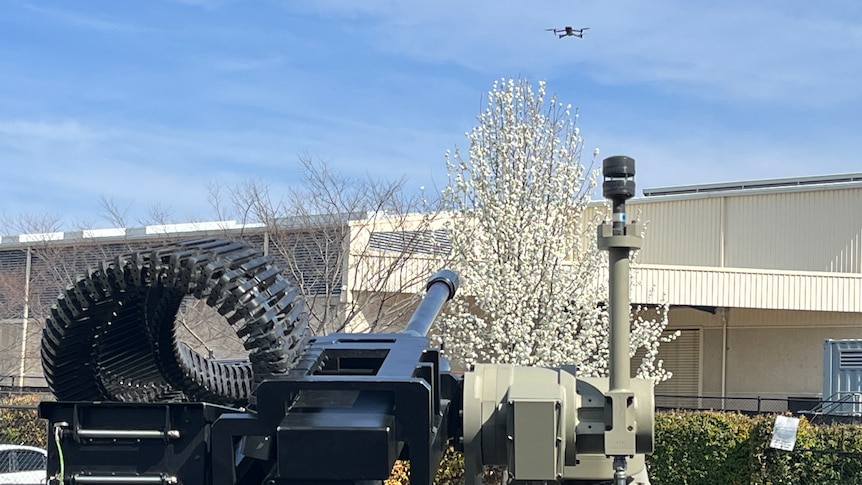 Slinger counter drone system aiming at a drone in the air. 
