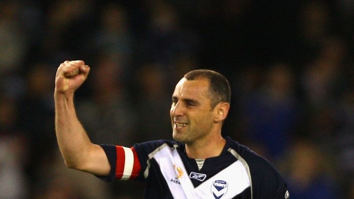Victory skipper Kevin Muscat celebrates his penalty goal against the Roar
