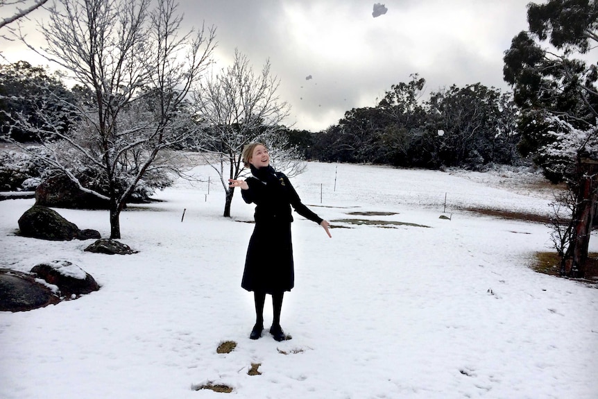 Abbie Reeves throws a snowball after snowfall in Stanthorpe in 2015.