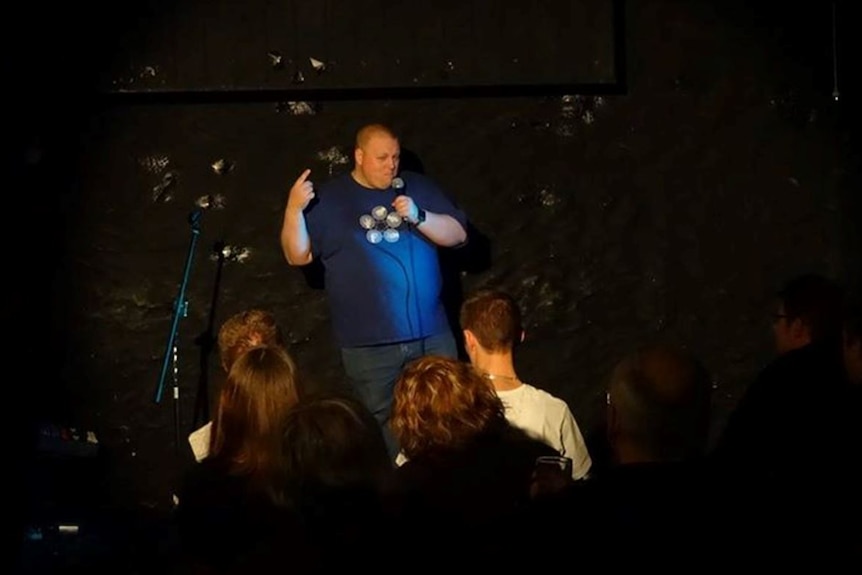 Ben Klingberg on stage during a comedy gig in Hobart.