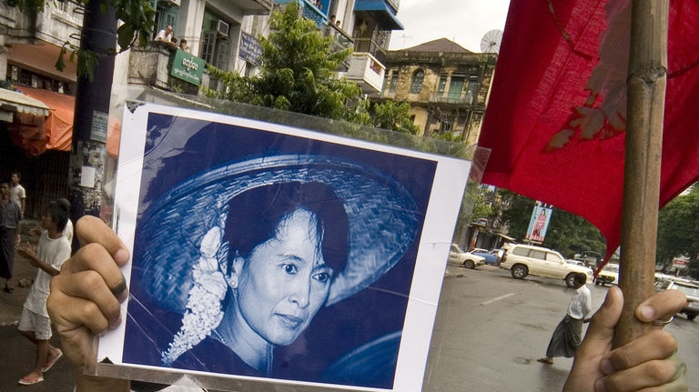 Activist holds Aung San Suu Kyi photo in Rangoon, Burma