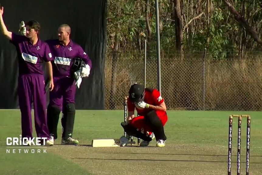 Cameron Bancroft hits the ground after being hit in the throat