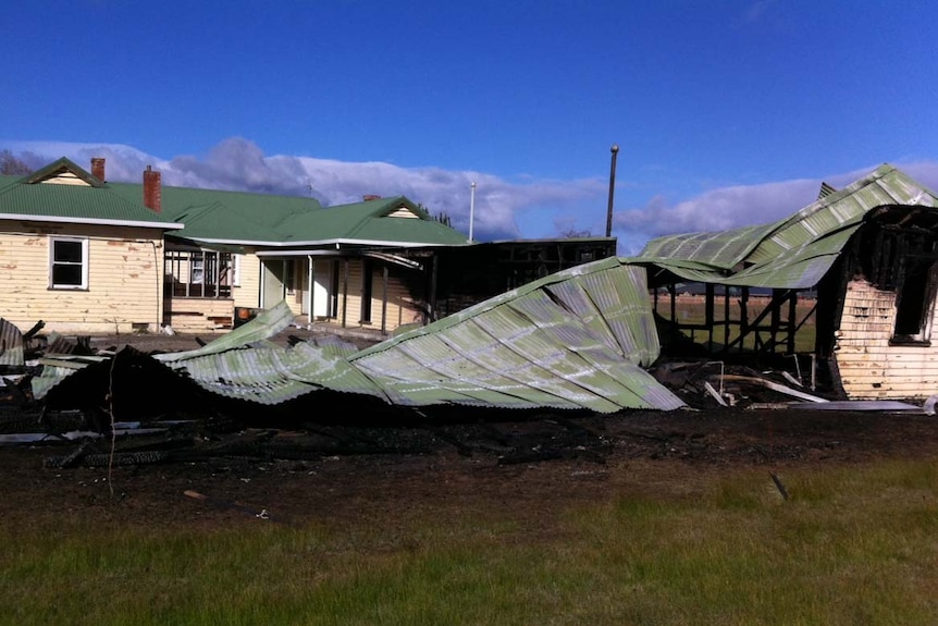 Roof of army barracks collapsed on the ground after a fire destroys heritage listed building near Hobart.