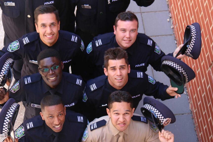 A group of 10 people dressed in police uniforms