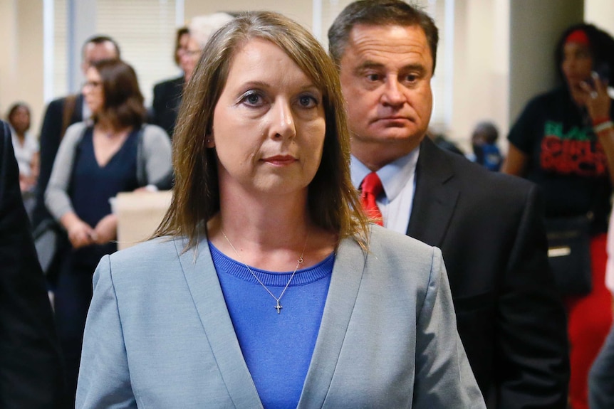 Betty Shelby leaves the courtroom with her husband.