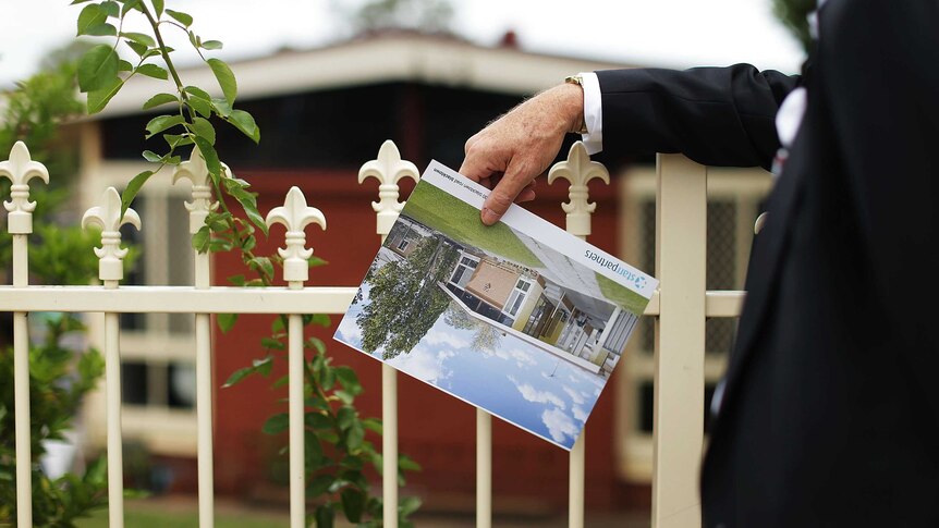 A buyer looks at a property in Blacktown before it was sold for $565,000 at auction.