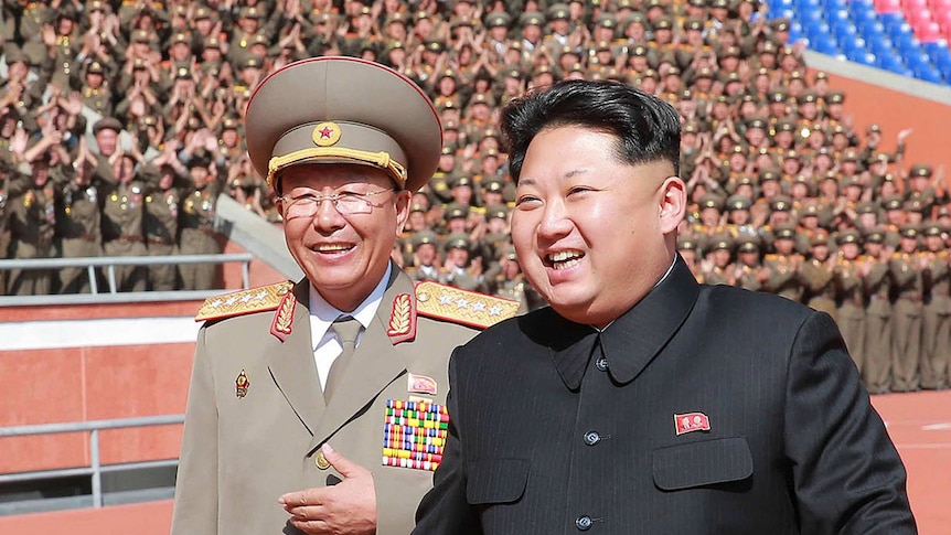 North Korean leader Kim Jong-un walking with army chief Ri Yong-gil.