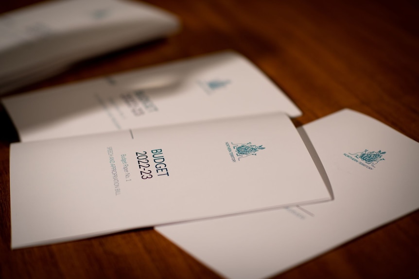 A small pile of booklets on a desk, with the words 'Budget 2022-23' written on them