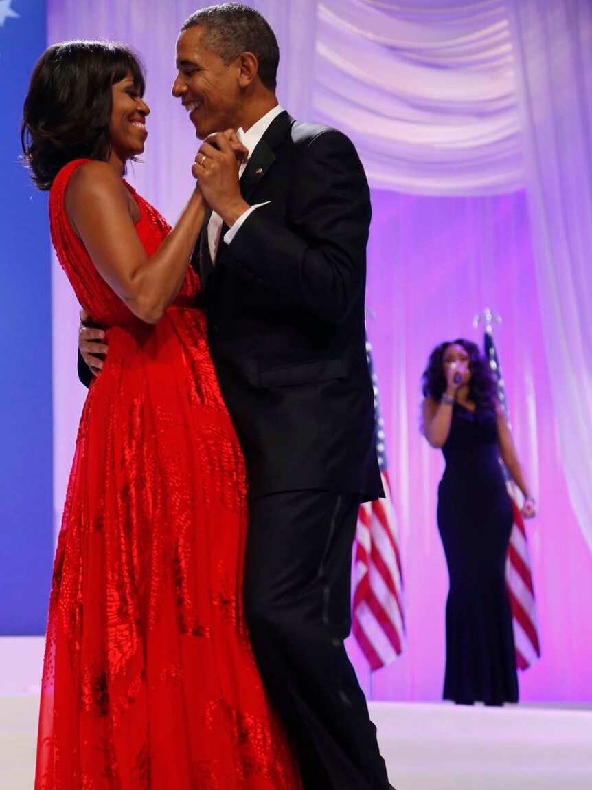 Barack Obama and his wife Michelle dance