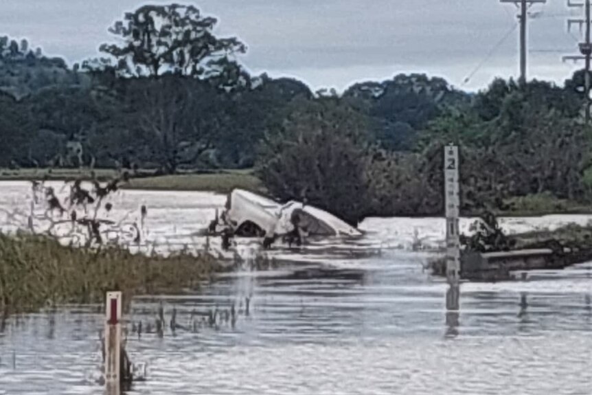 A ute submerged in floodwater.