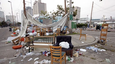 Ghost town: Empty chairs and debris outside the evacuated New Orleans Convention Centre.
