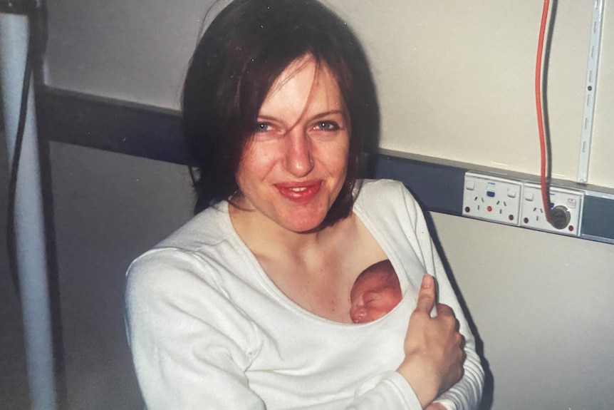 Kaz holds a newborn Oona under her shirt in a 'kangaroo cuddle'.
