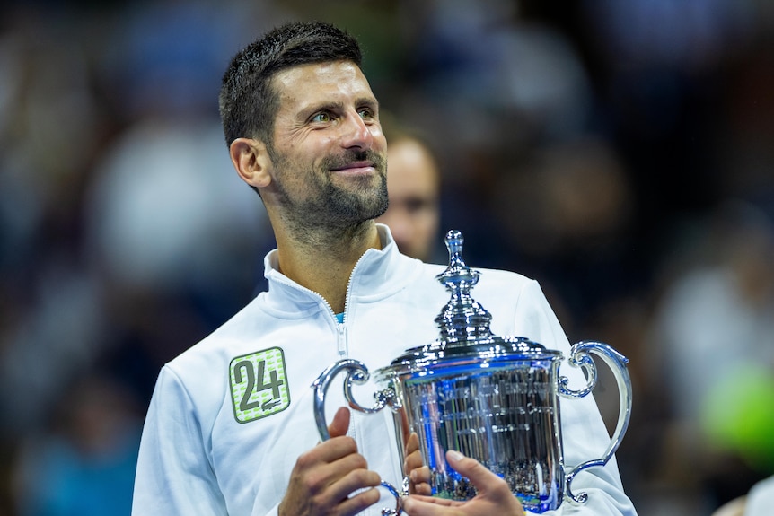 Novak Djokovic holds the US Open trophy