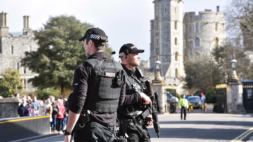 Armed officers stand near Windsor Castle