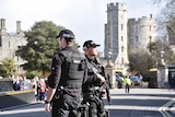 Armed officers stand near Windsor Castle