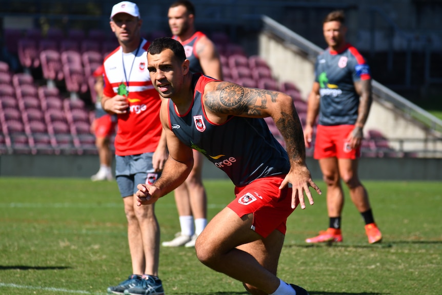 A photo of a football player running.