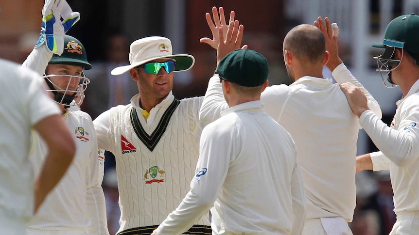 Clarke hi-fives after wicket taken during Ashes