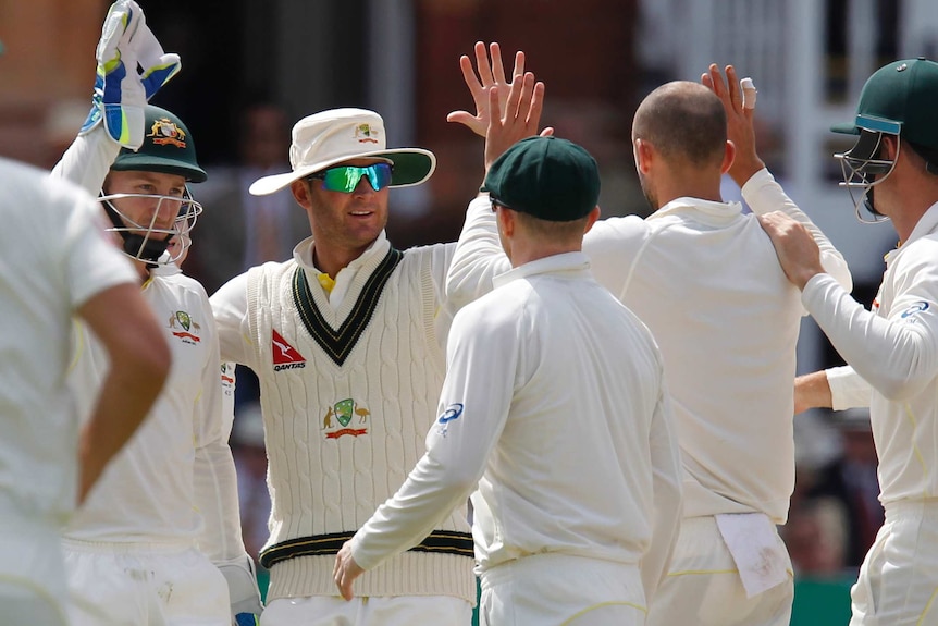 Clarke hi-fives after wicket taken during Ashes