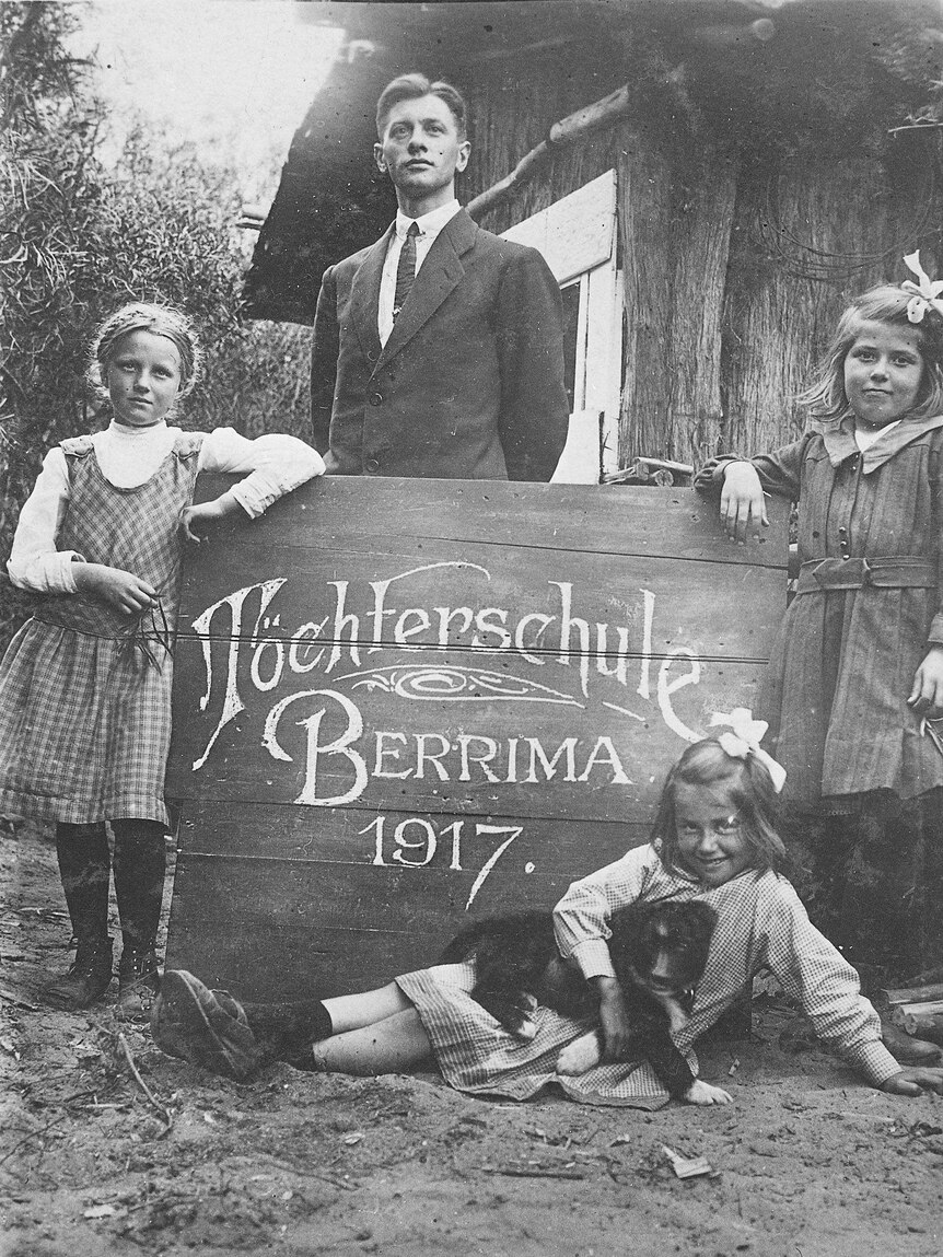 Teacher with German school children at internment camp at Berrima