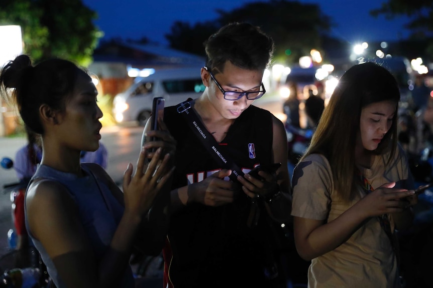 People check for updates on Thai cave boys