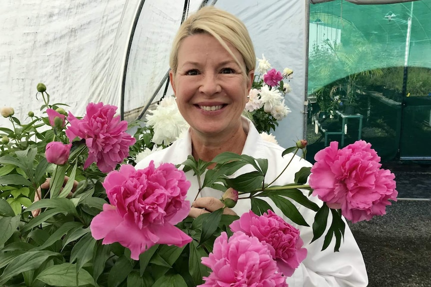 Krista Bogiatzis with her pink and white peonies.