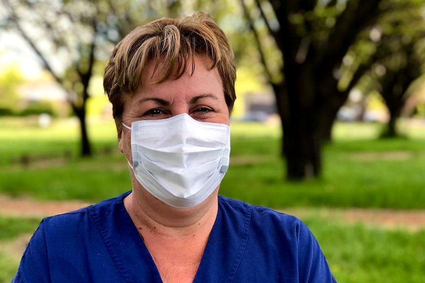 Female nurse wearing a mask. 
