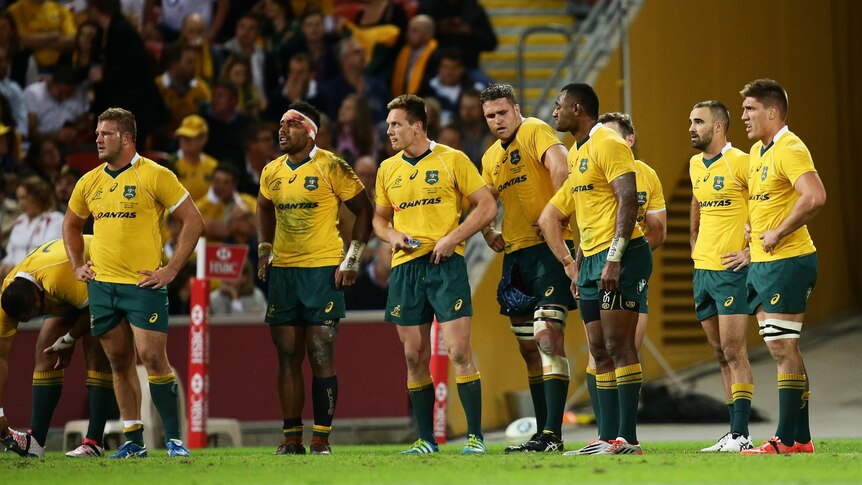 Wallabies look on after an England try