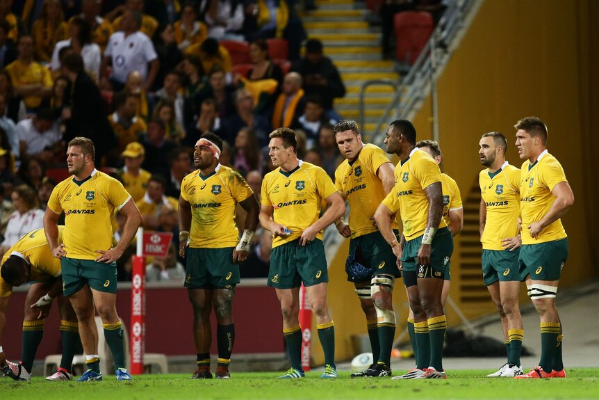 Wallabies look on after an England try