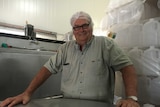 Dick Schroder stands behind a milk vat in his processing plant at Dagun.