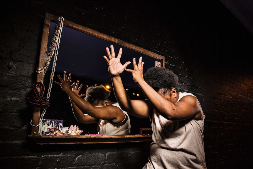 Still photograph of performer Ghenoa Gela during a scene in My Urrwai at Belvoir Theatre.