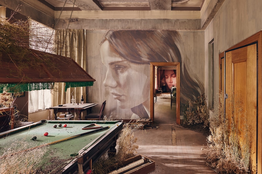 Billiard room with dust and plants overgrown and murals on walls
