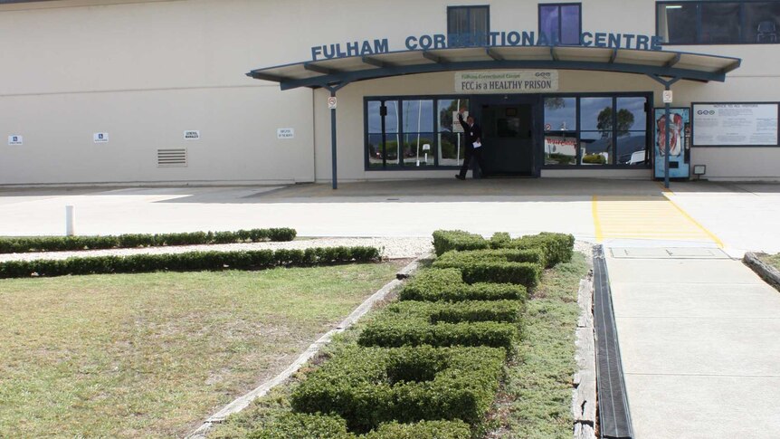 Green hedges spell "welcome" at the entrance of Fulham Correctional Centre.