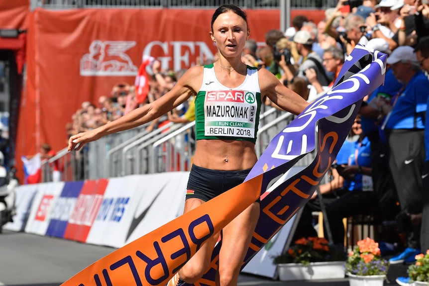 Volha Mazuronak crosses the finish line after winning the women's marathon at the European Championships.