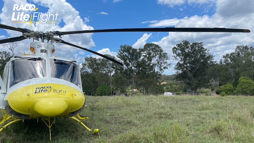 An image of a yellow RACQ LifeFlight Rescue helicopter 