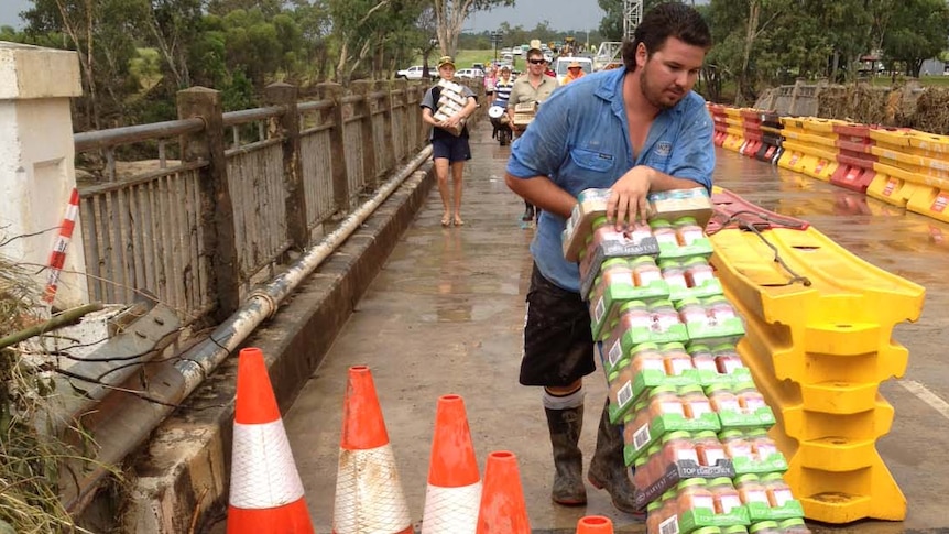 Essential food supplies are delivered to the flood-devastated town of Mitchell